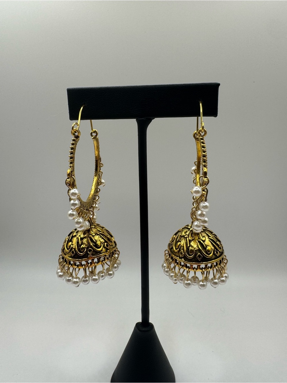 Gold Jhumka Earrings with White Pearl Accents